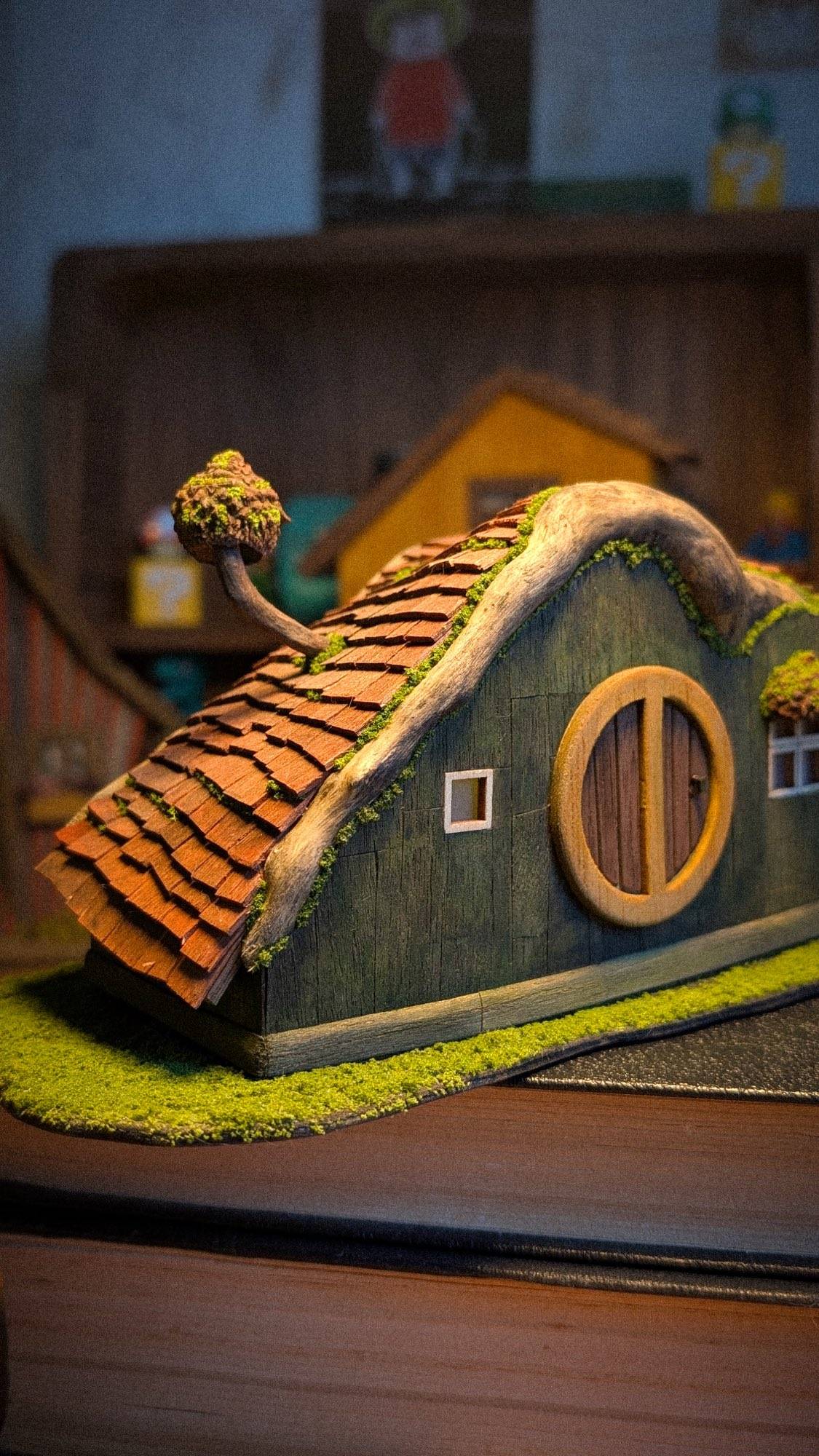The cottage on the workbench before it found its stack of books