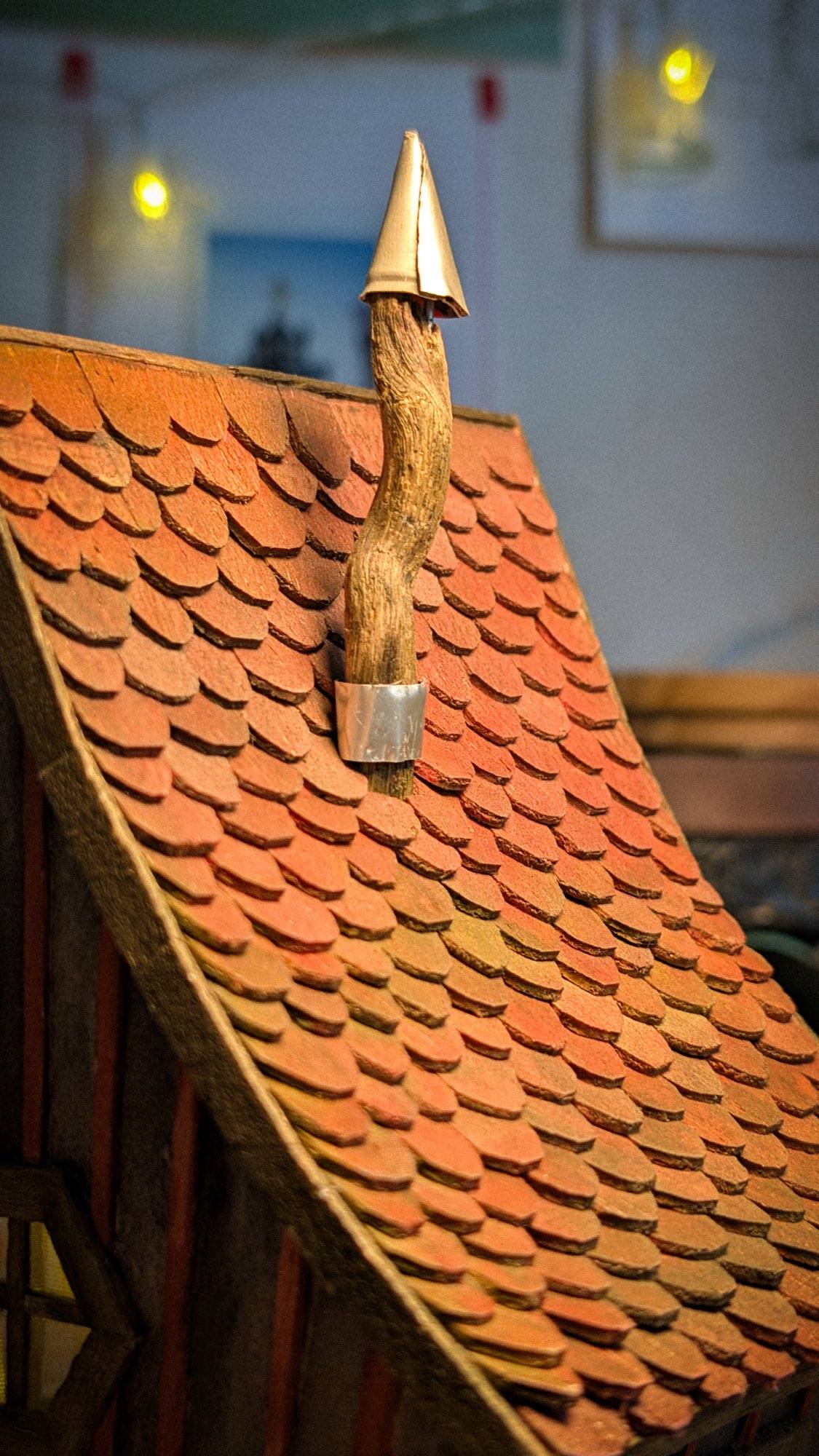 The roof ridge and tin-capped chimney seen from above on the workbench