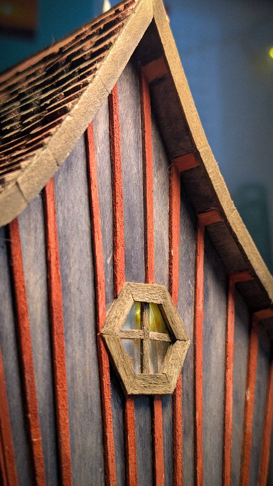 The hexagonal window close up, its frame pieced together from hand-cut strips